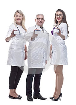 In full growth. a group of qualified doctors showing their visiting card.