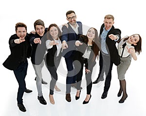 in full growth. group of young business people pointing at you .