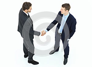 In full growth.handshake, business partners ,isolated on white background.