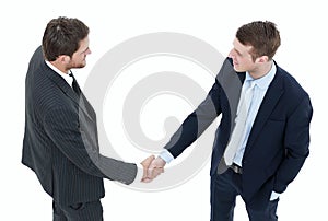 In full growth.handshake, business partners ,isolated on white background.