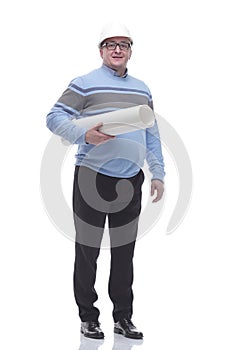 In full growth. man in a protective helmet holds a roll of drawings