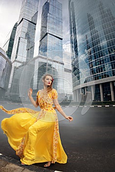 Full growth portrait of fashionable woman on urban background