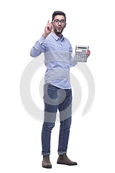 in full growth. smart young man with a calculator .