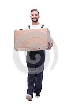 In full growth. smiling man carries a large cardboard box