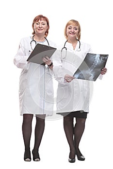 in full growth. two female doctors with x-rays.