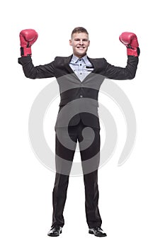 in full growth. young businessman in Boxing gloves.