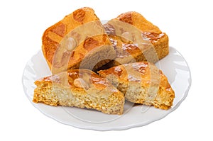 Full and halves of cookies with marzipan in plate isolated on white