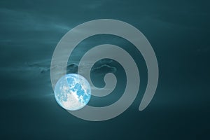 full harvest moon on dark sky back cloud over space