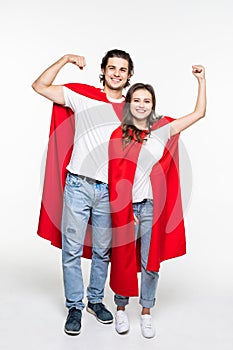 Full height Young couple wear in super hero cout show the power isolated on white background