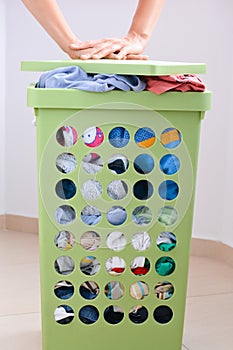 Full laundry basket with dirty clothes