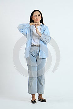 full leght shoot of asian indonesian woman with time out sign gesture on isolated background photo