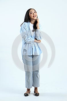 full leght shoot of happy asian Indonesian woman wearing casual attire on isolated background