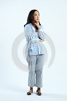 full leght shoot of pensive asian indonesian woman on isolated background