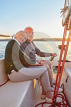 Full leghth of happy senior couple, elderly man and woman holding hands, hugging and spending time together while