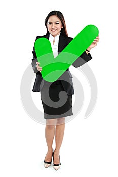 Full lenght of businesswoman holding check mark sign