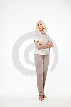 Full-lenght image of smiling mature old woman photo