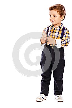 Full lenght portrait of an adorable little boy showing thumbs up photo