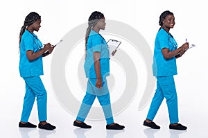 Full length 20s young African American Woman Medical Healthcare Nurse, walking forward left right