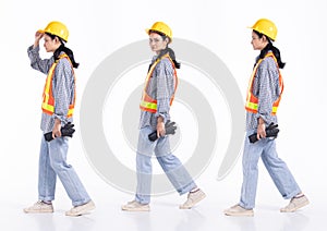 Full length 20s young Mix Race engineer contractor Woman, walking forward left right