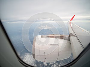 Full length of aircraft engine from window seat in the air.