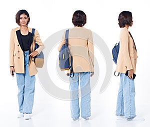 Full length of Asian Indian 20s working woman with curl hair hold cell smart phone backpack blazzer