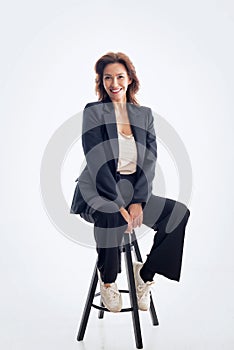 Full length of an attractive brunette haired woman wearing business casual and cheerful smiling against isolated background
