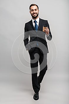 Full length of an attractive smiling young businessman