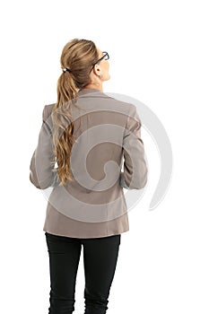 Full-length back side of businesswoman, isolated on white.