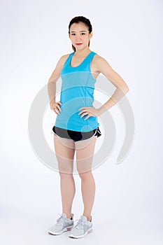 Full-length beautiful portrait young asian woman in sport clothing with satisfied and confident isolated
