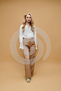 a full length of blonde woman photo