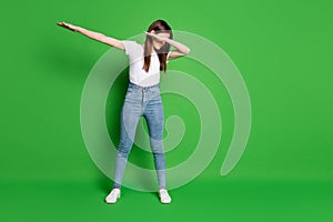 Full length body size photo of brunette girl wearing white t-shirt dancing showing hype dab sign isolated on green color