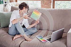 Full length body size photo female graphic designer using laptop showing color palettes on video connection