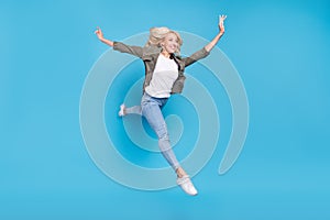 Full length body size photo happy woman jumping up careless running isolated pastel blue color background