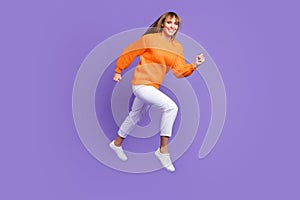 Full length body size photo of jumping high running on sale isolated pastel violet color background