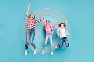 Full length body size photo of two rejoicing daughters with mother winning rejoicing white wearing jeans denim while