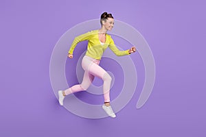 Full length body size photo of woman with girlish hairstyle jumping running fast on sale isolated on pastel violet color