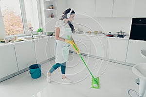 Full length body size portrait of her she nice beautiful wavy-haired house-wife using broom cleansing shine floor in