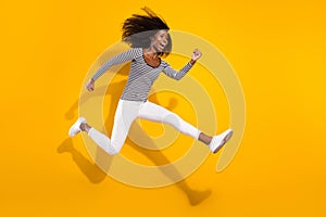 Full length body size side profile photo woman jumping up running on sale isolated vibrant yellow color background