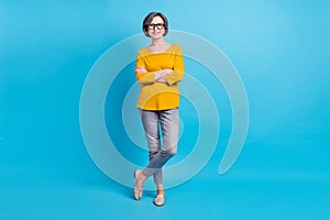 Full length body size view of attractive cheerful content woman posing folded arms isolated over vivid blue color