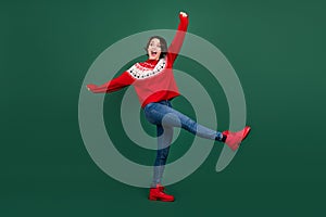 Full length body size view of attractive cheerful ecstatic girl dancing fooling isolated over green color background