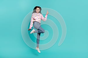 Full length body size view of attractive cheery funny girl jumping showing v-sign good mood isolated on shine teal