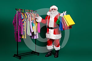 Full length body size view of his he nice fat fat overweight Santa selling season garment outlet center carrying buyings photo