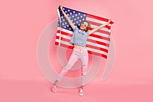 Full length body size view portrait of her she nice cute charming attractive cheerful girl holding in hands us flag