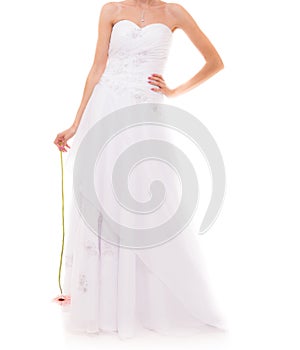 Full length bride in white wedding gown isolated