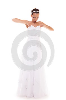 Full length bride in white wedding gown isolated