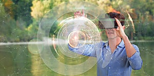 Composite image of full length of businessman using virtual reality simulator