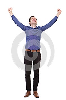 Full length carefree young man standing with arms outstretched in joy