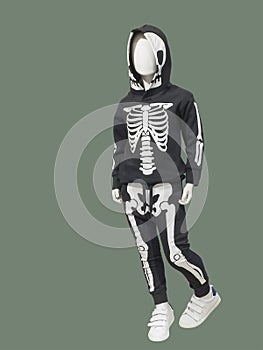 Full-length child mannequin in a skeleton suit