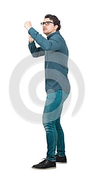 Full length of confident and frustrated businessman ready for struggle standing in fighting position isolated on white. Business