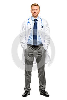 Full length of confident young doctor on white background